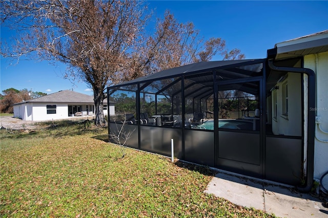 view of yard featuring glass enclosure