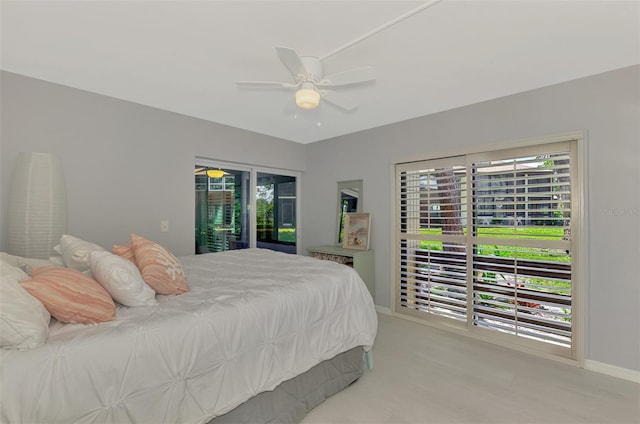 bedroom featuring multiple windows, access to outside, and ceiling fan