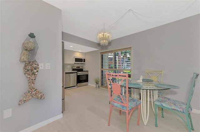 dining area featuring a chandelier