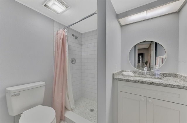 bathroom with vanity, toilet, and curtained shower