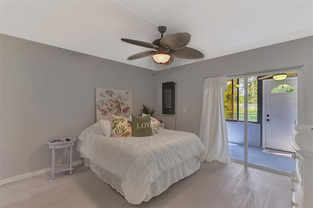 bedroom with ceiling fan and access to exterior