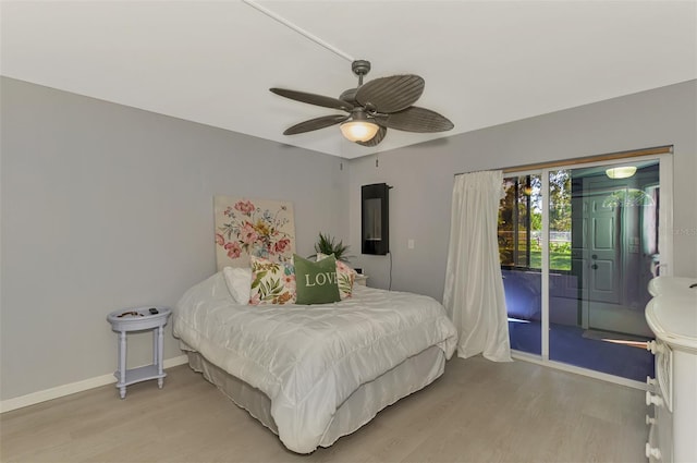 bedroom with light hardwood / wood-style floors, ceiling fan, and access to exterior