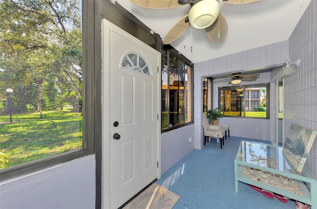 interior space with a yard and ceiling fan