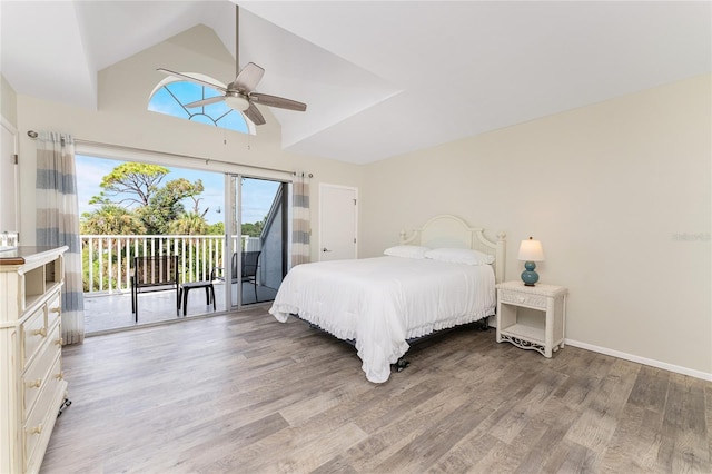 bedroom featuring ceiling fan, light hardwood / wood-style floors, access to exterior, and lofted ceiling