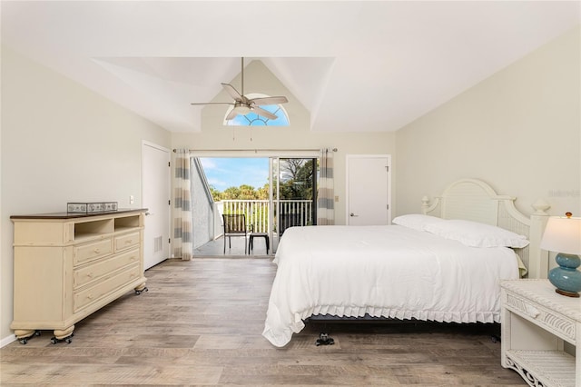 bedroom featuring access to outside, ceiling fan, vaulted ceiling, and light wood-type flooring