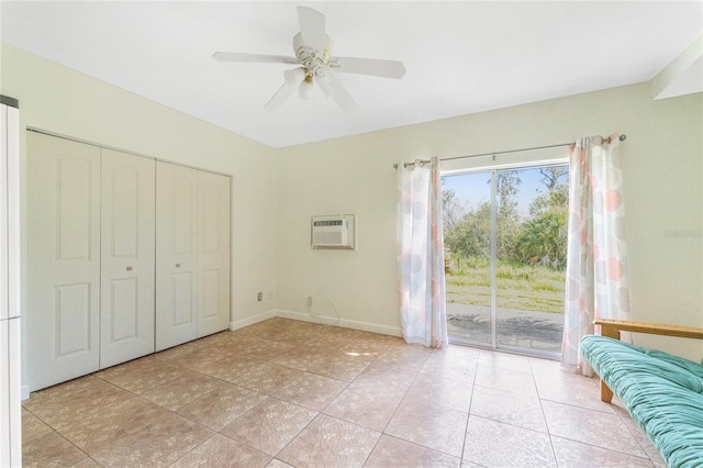 unfurnished bedroom featuring access to exterior, ceiling fan, an AC wall unit, a closet, and light tile patterned floors