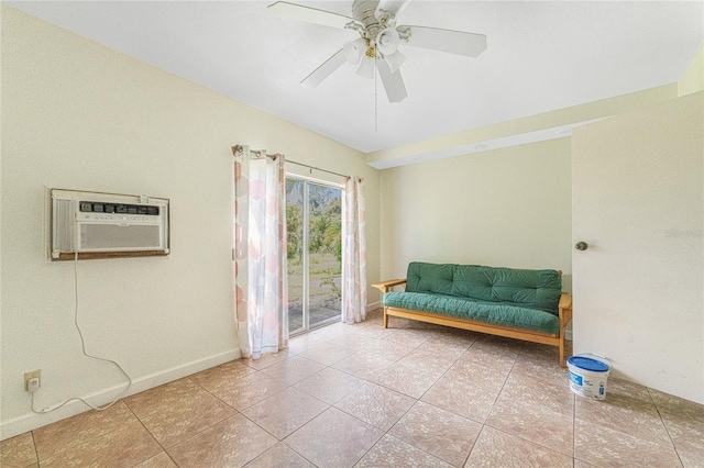 sitting room with tile patterned flooring, ceiling fan, and an AC wall unit