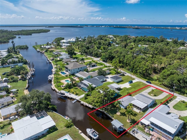 bird's eye view featuring a water view and a residential view