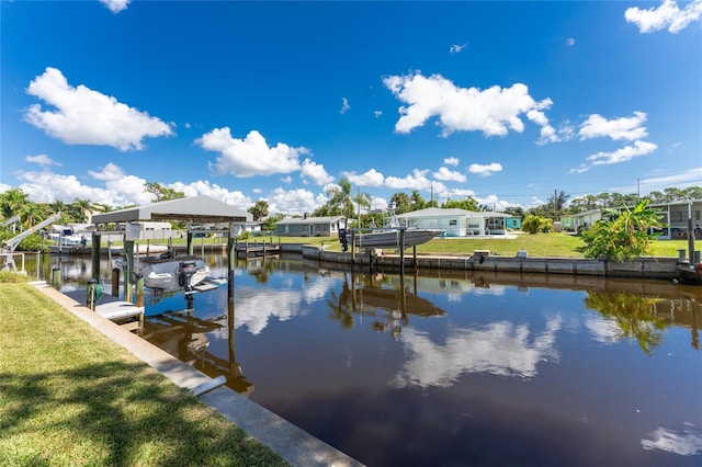 dock area featuring a yard, a residential view, and boat lift