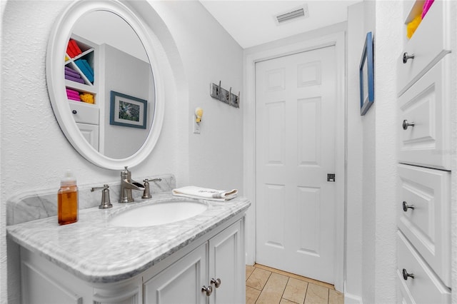 bathroom featuring tile patterned floors, visible vents, and vanity