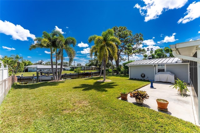 view of yard featuring a patio and fence