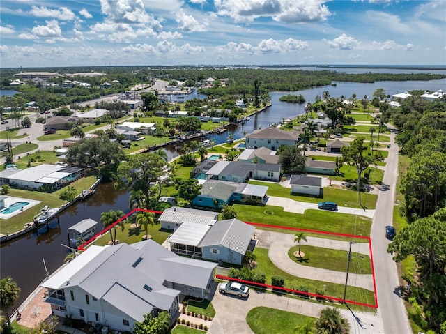 bird's eye view with a residential view and a water view