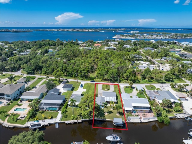 bird's eye view featuring a residential view and a water view