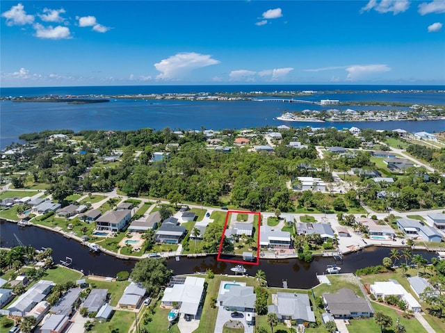 bird's eye view featuring a residential view and a water view