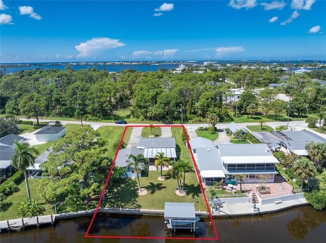 drone / aerial view with a water view