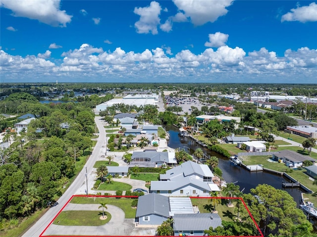 bird's eye view featuring a residential view and a water view