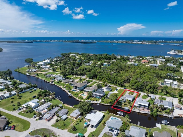 aerial view featuring a residential view and a water view