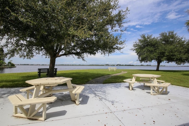 view of patio with a water view