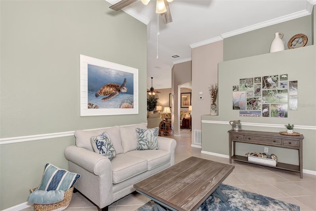 tiled living room featuring crown molding, a towering ceiling, and ceiling fan