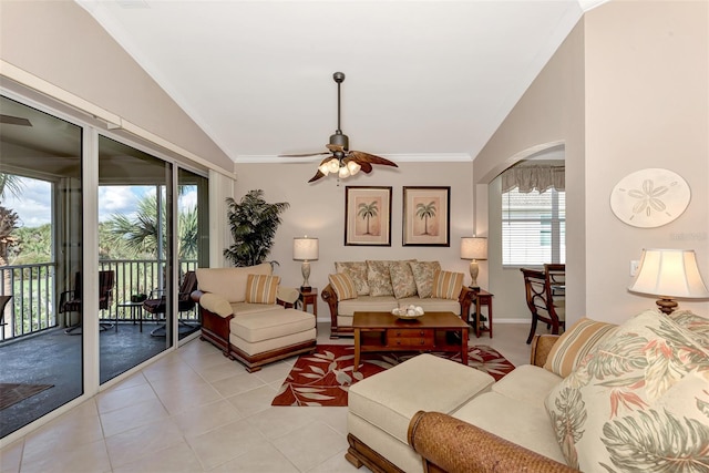 living room featuring light tile patterned floors, crown molding, vaulted ceiling, and ceiling fan