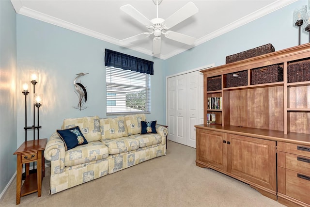 living room with crown molding, light colored carpet, and ceiling fan