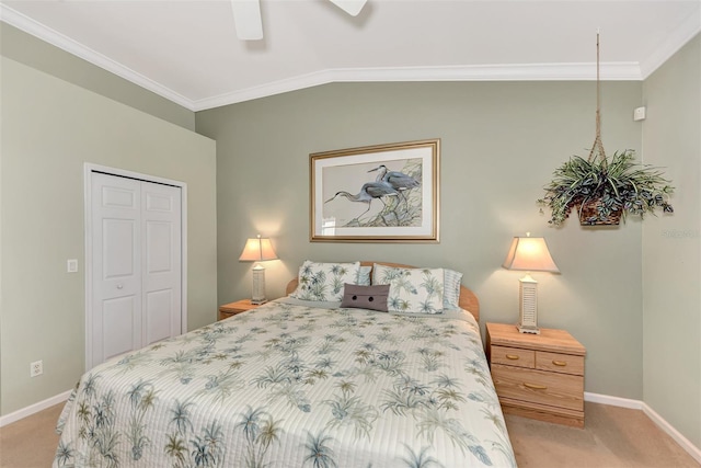 carpeted bedroom with crown molding, ceiling fan, lofted ceiling, and a closet