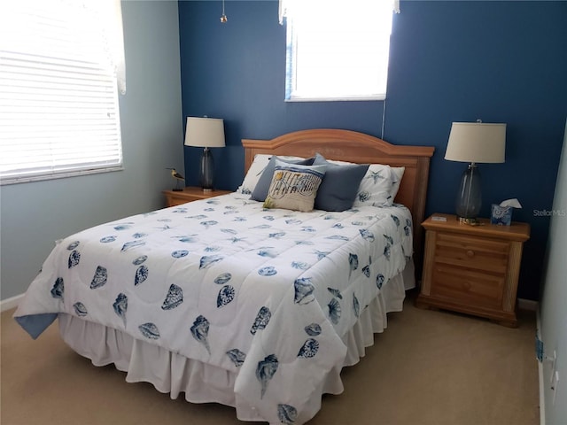 bedroom with light colored carpet