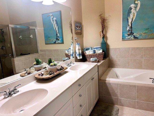 bathroom with tile patterned floors, independent shower and bath, and vanity