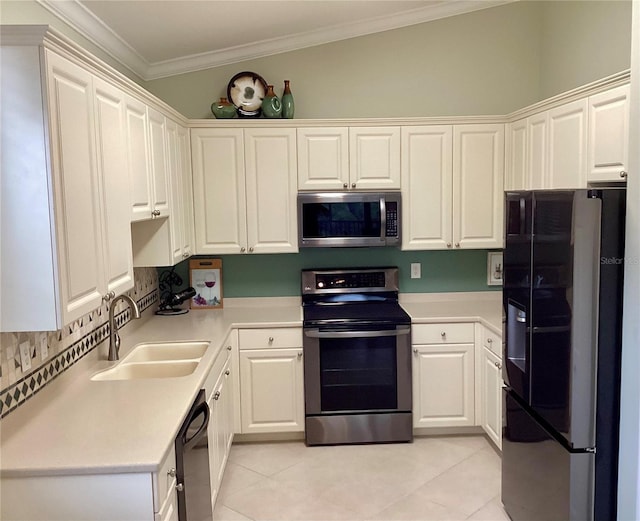 kitchen with sink, crown molding, white cabinetry, backsplash, and black appliances