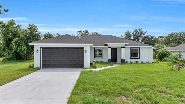 view of front of home featuring a garage and a front lawn