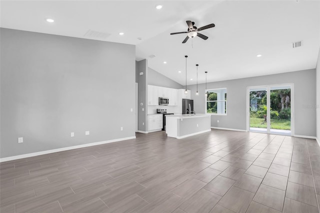 unfurnished living room featuring high vaulted ceiling, light wood-type flooring, and ceiling fan