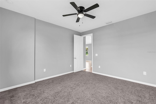 unfurnished room featuring carpet and ceiling fan