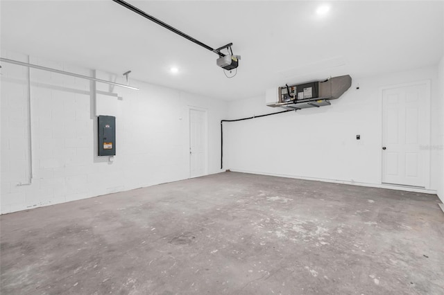 garage featuring electric panel and a garage door opener