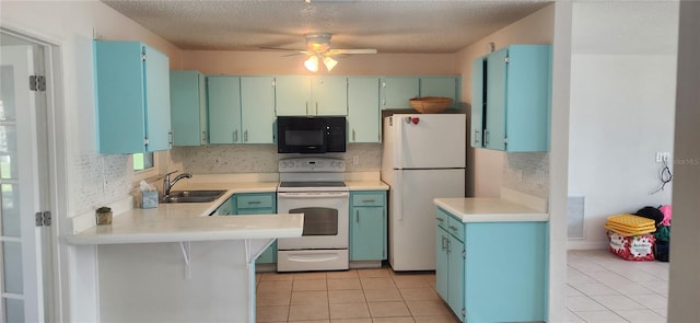 kitchen with light tile patterned flooring, ceiling fan, white appliances, and sink