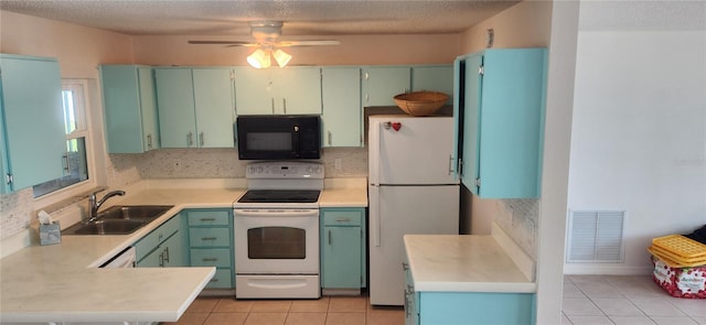 kitchen featuring ceiling fan, light tile patterned floors, sink, white appliances, and a textured ceiling