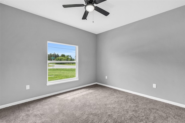 carpeted empty room with ceiling fan