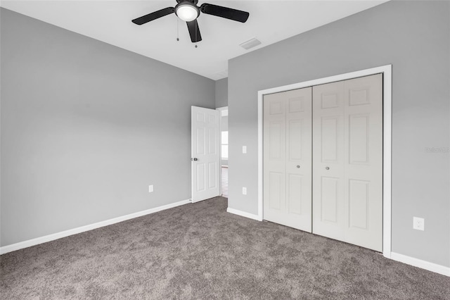 unfurnished bedroom with a closet, ceiling fan, and carpet