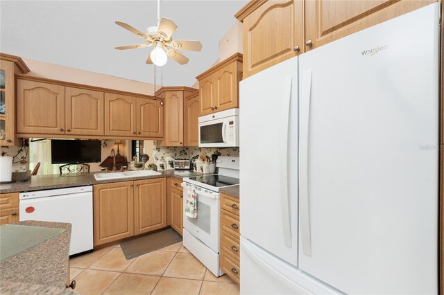 kitchen featuring decorative backsplash, white appliances, light tile patterned floors, and sink