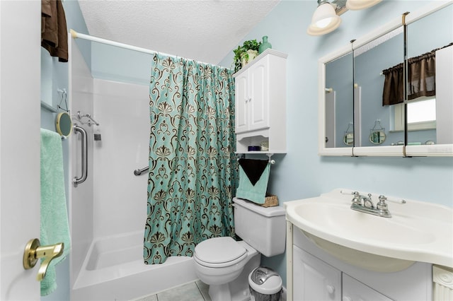 bathroom with curtained shower, vanity, a textured ceiling, toilet, and tile patterned floors