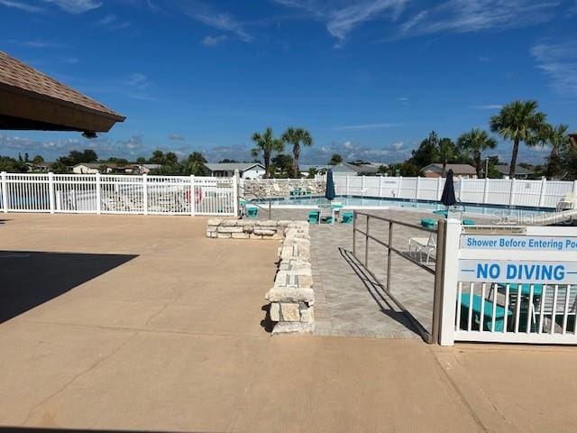 view of patio with a community pool