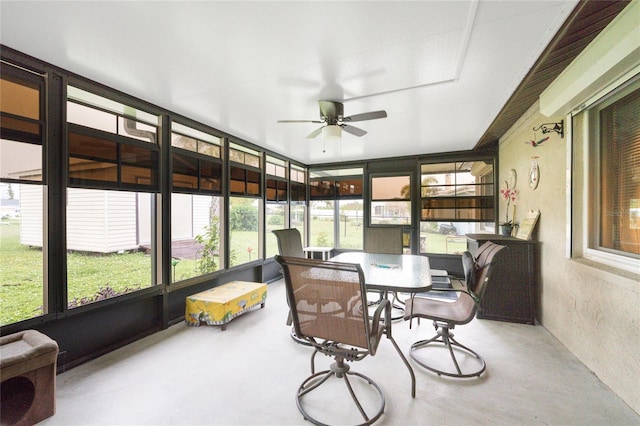 sunroom / solarium featuring ceiling fan and a healthy amount of sunlight