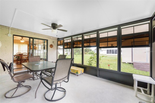 sunroom / solarium with a wealth of natural light and ceiling fan