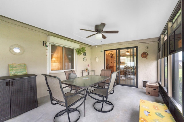 sunroom / solarium with a wealth of natural light and ceiling fan