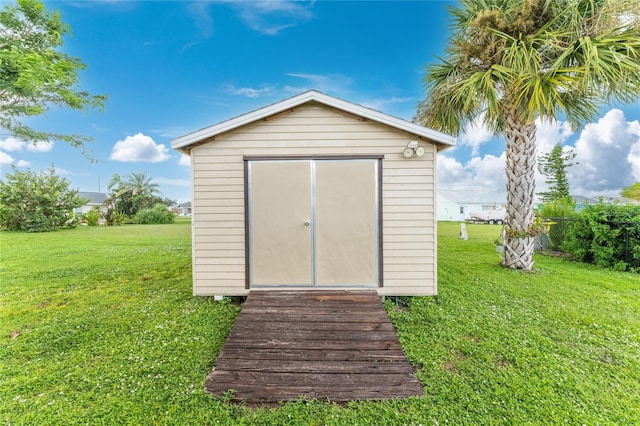 view of outdoor structure with a lawn