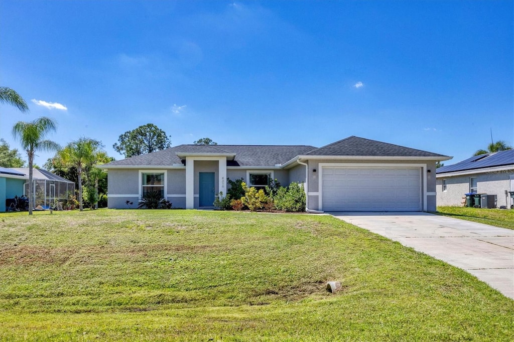 ranch-style home with a front yard and a garage