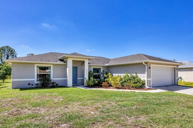 view of front of property with a front yard and a garage