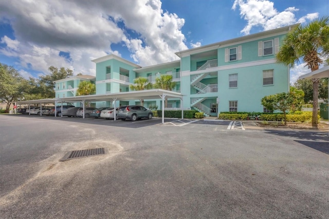 view of vehicle parking featuring a carport