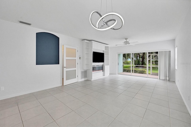 unfurnished living room with built in shelves, light tile patterned flooring, and ceiling fan