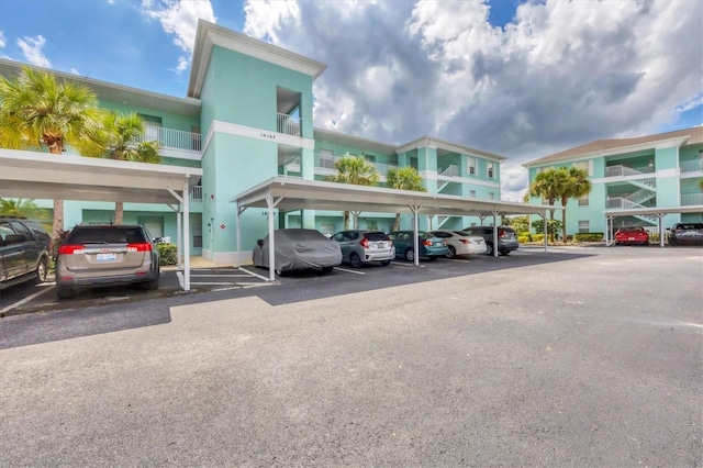 view of parking / parking lot with a carport