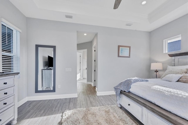 bedroom with ceiling fan and light hardwood / wood-style floors